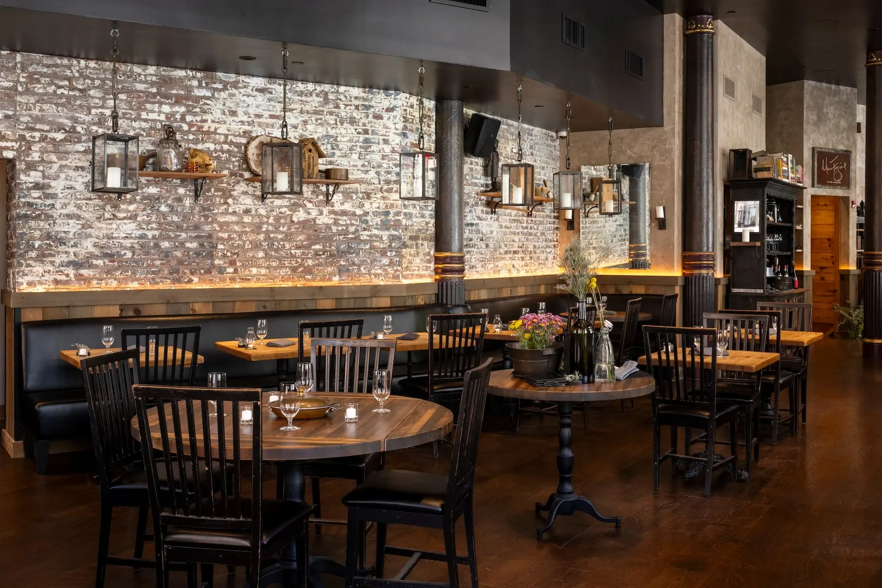 Window tables at Marc Forgione with leather banquettes and city views