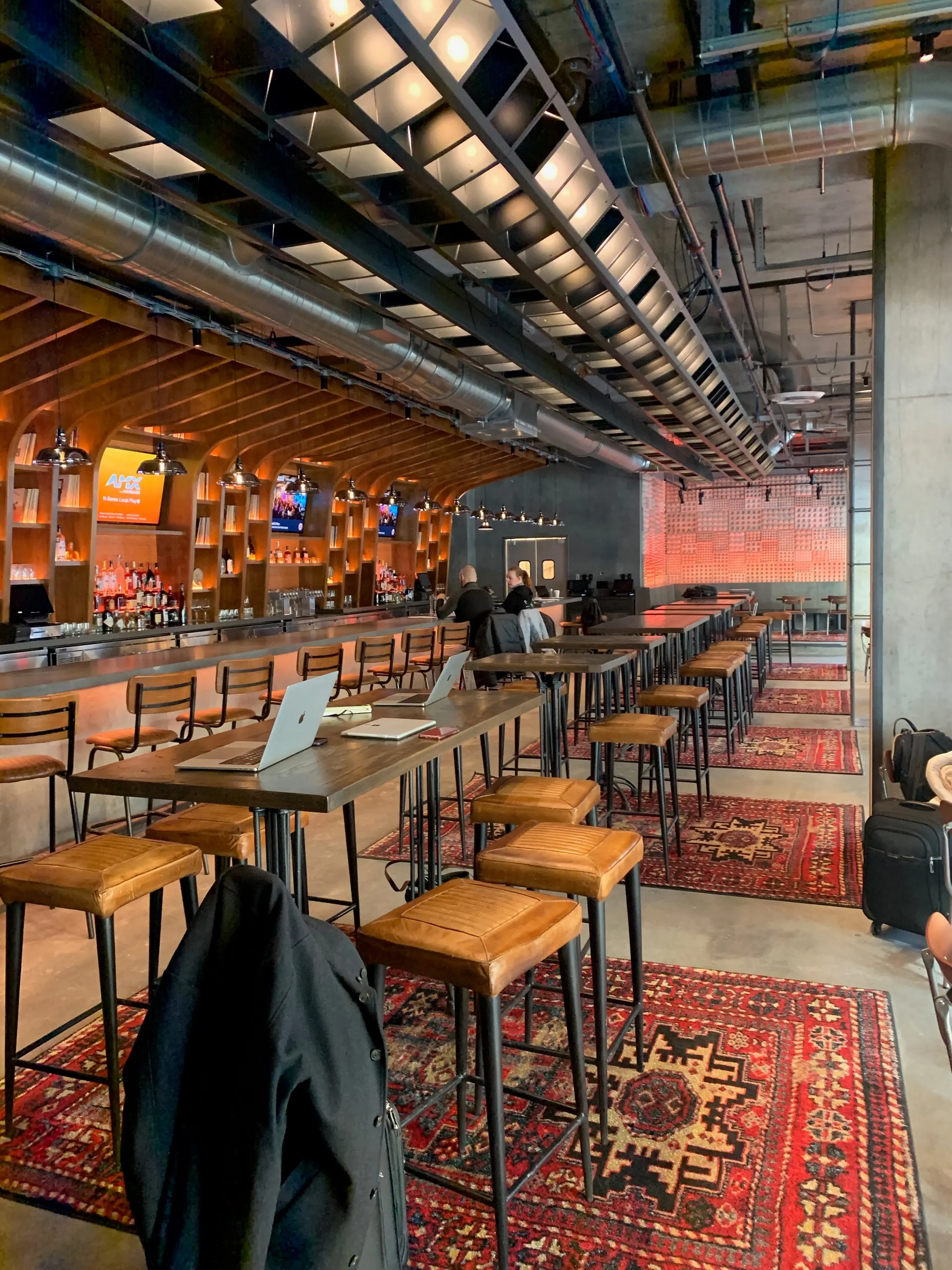 Trax bar seen from a high table, record casework curving overhead