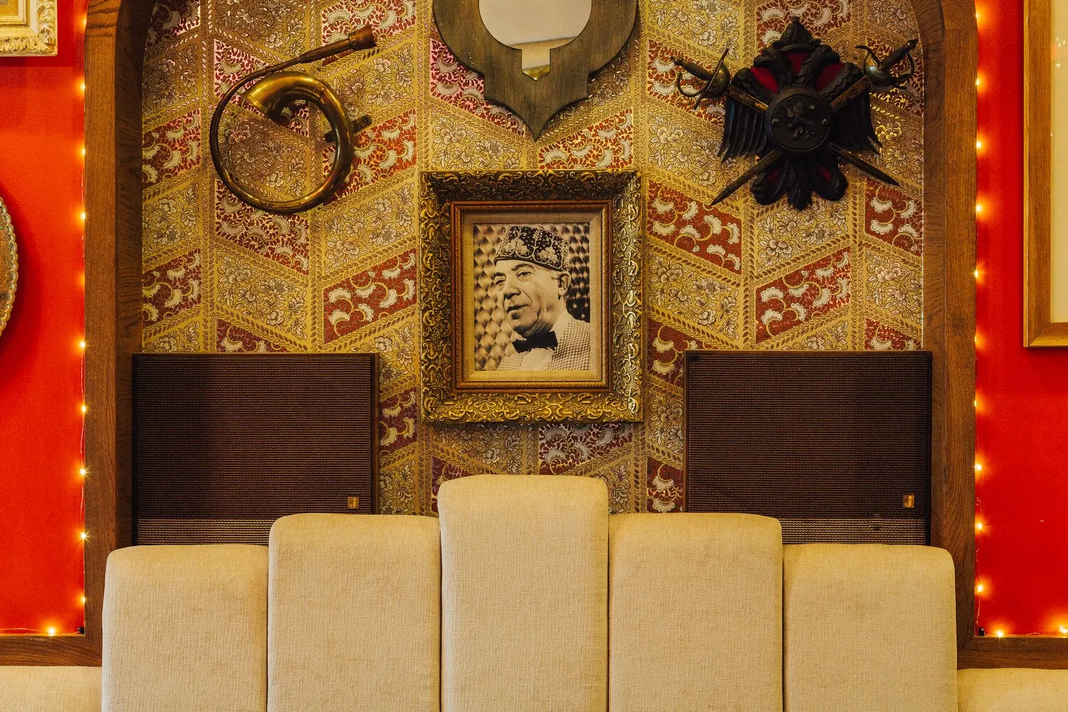 Tufted banquette and patterned wallcovering at Turk's Inn