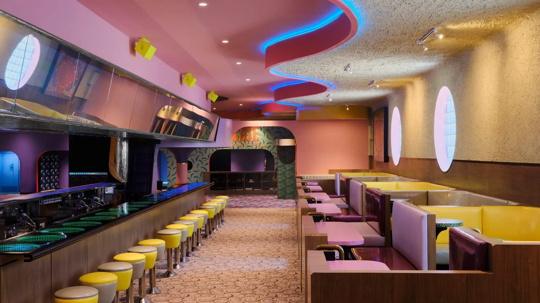 Yellow and green booths beside the rink at Xanadu