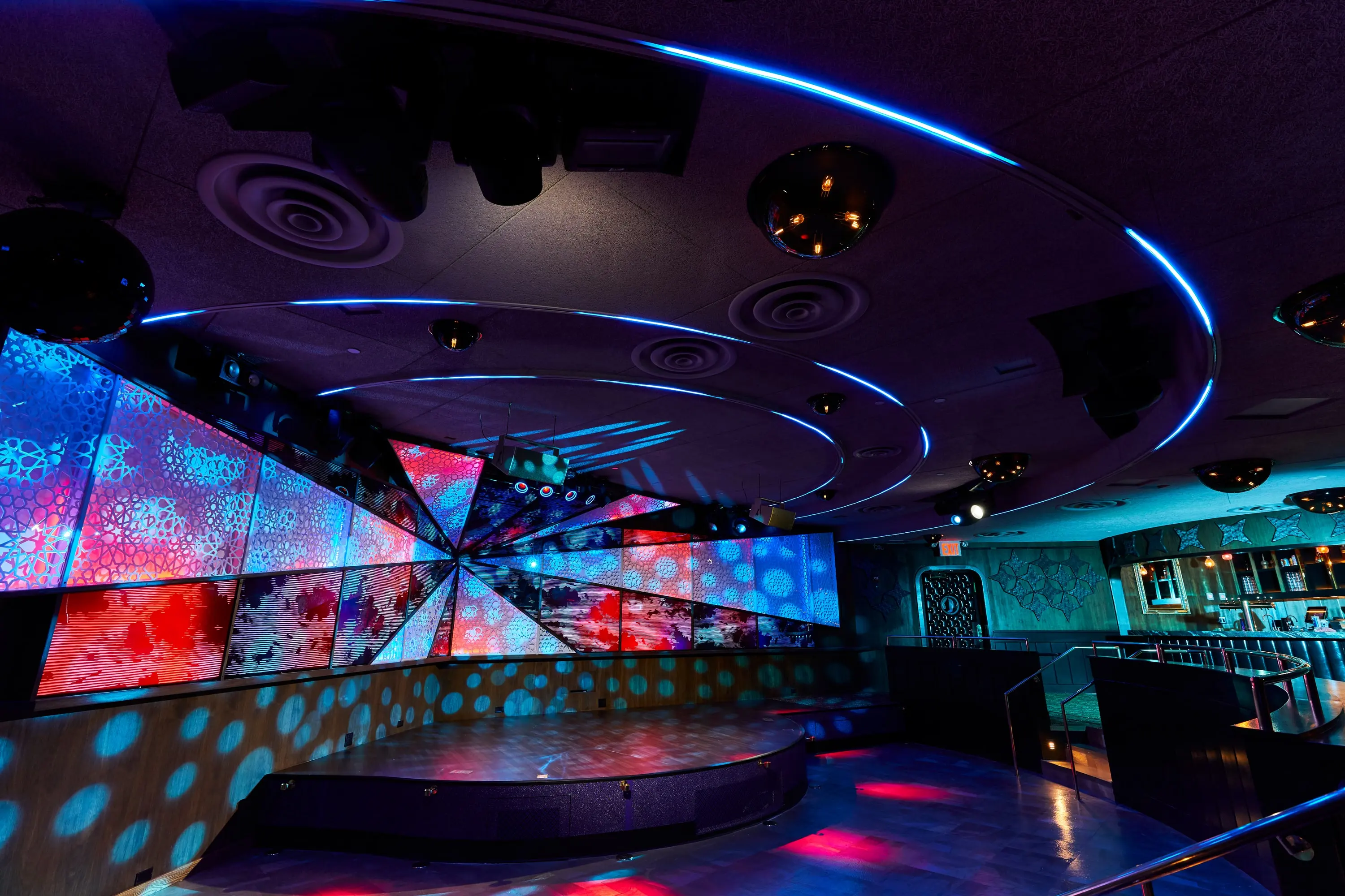 The Sultan Room LED wall lit in rainbow colours across the stage