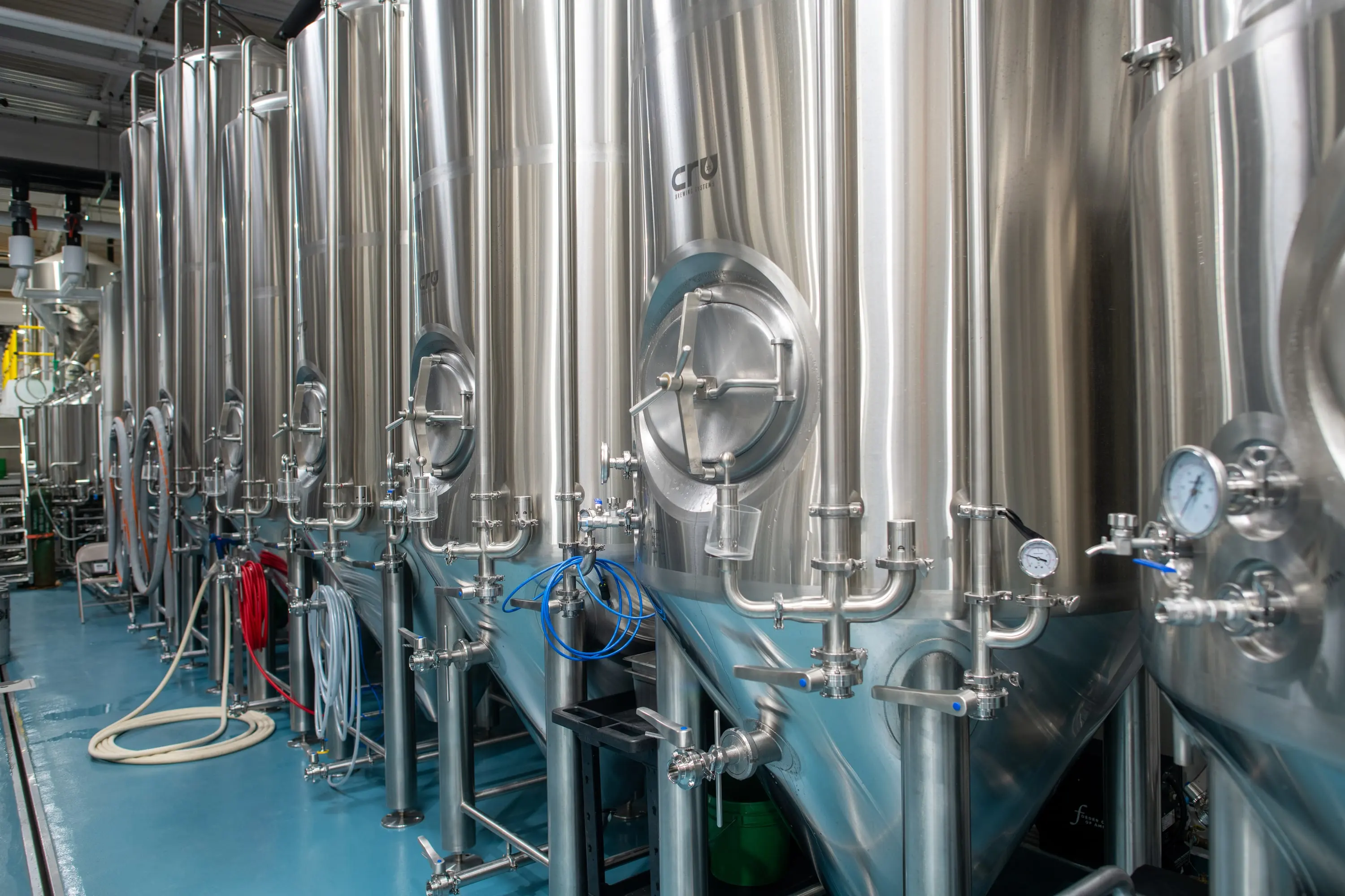 Stainless brewhouse tanks and piping at Eckhart Beer Co
